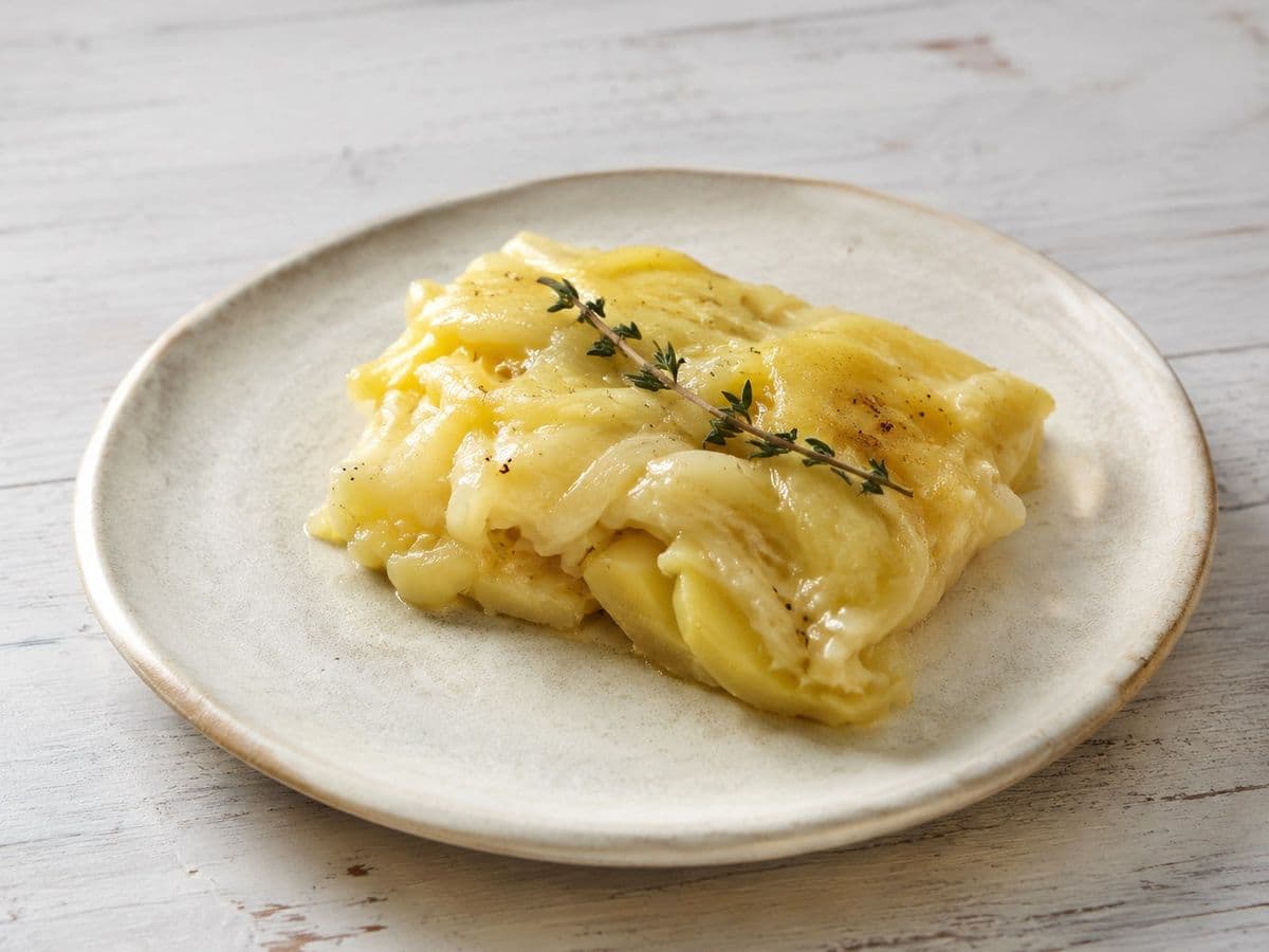Cheese and onion pie, plated as one serving.