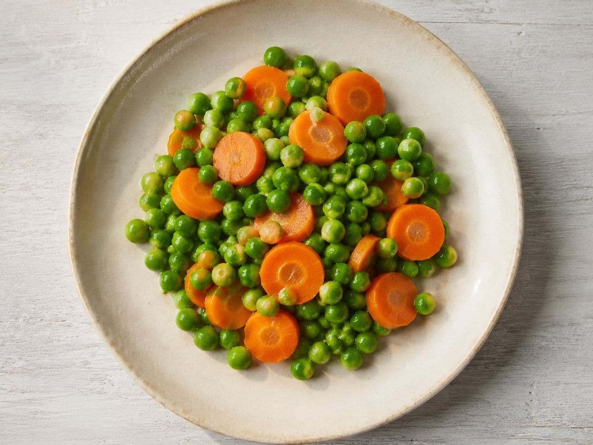 Peas and carrots, plated as one serving.