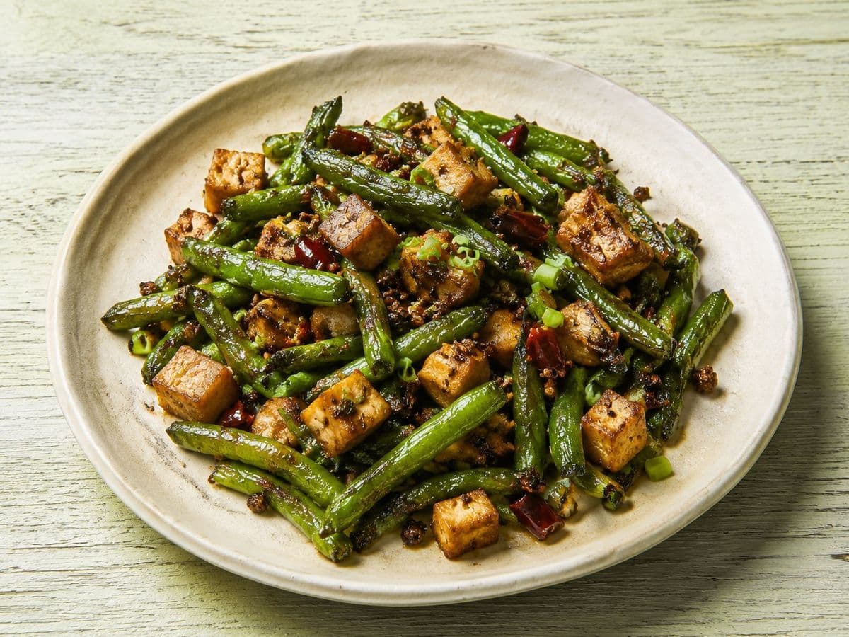 Sichuan Dry-Fried Green Beans, plated as one serving.