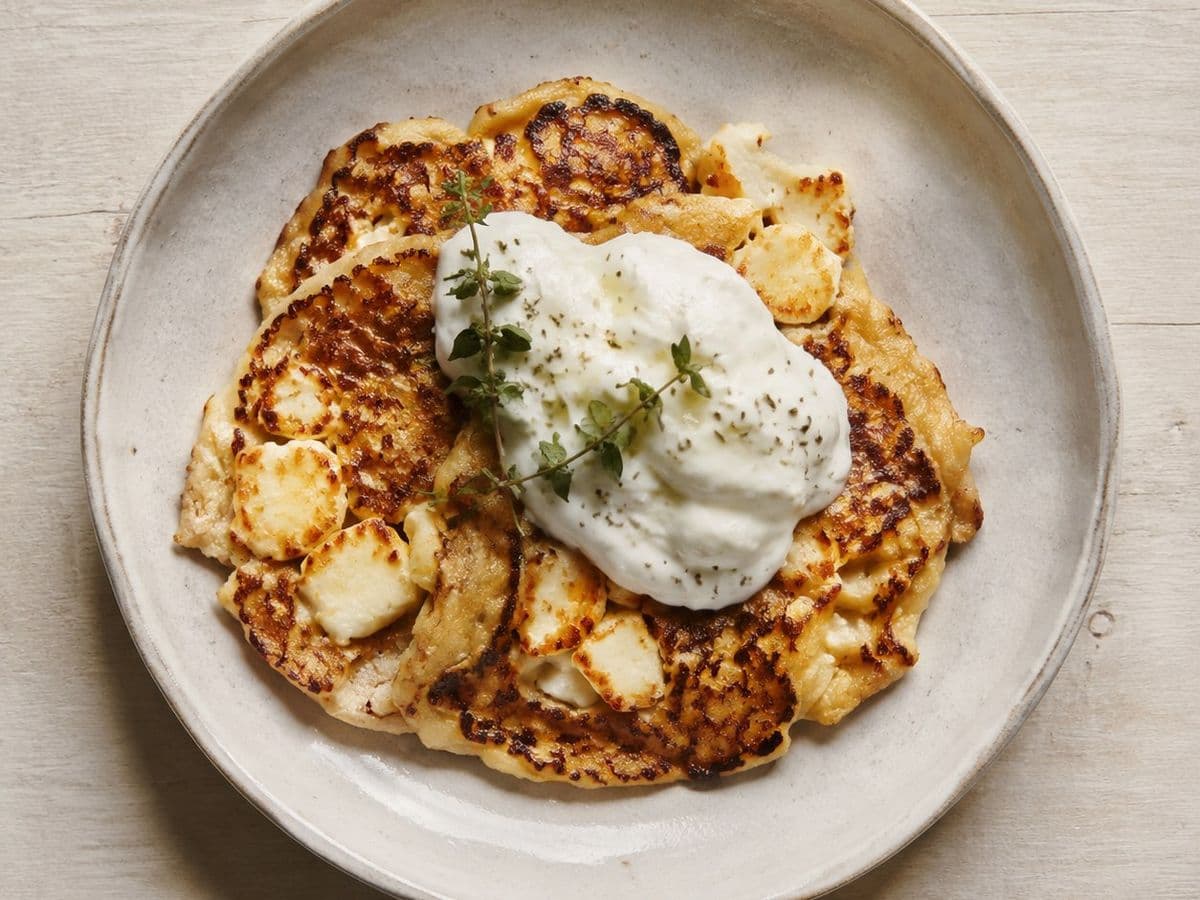 Tiganites me Halloumi, plated as one serving.