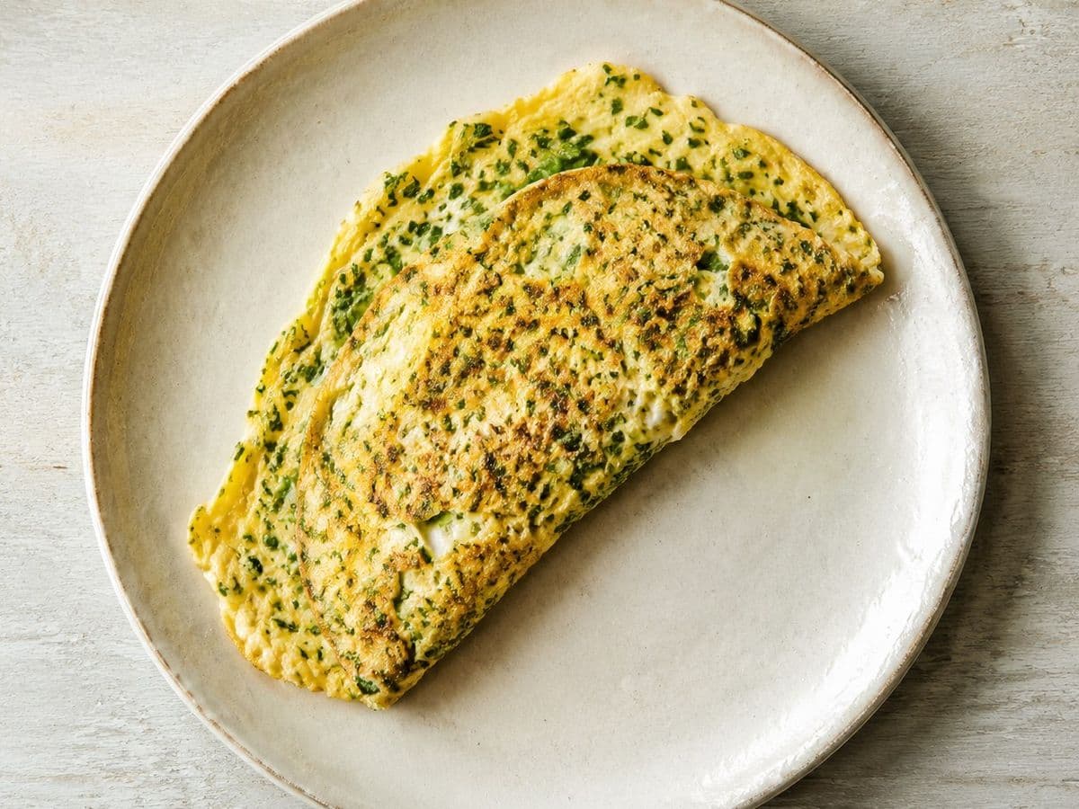 Omelette aux Fines Herbes, plated as one serving.