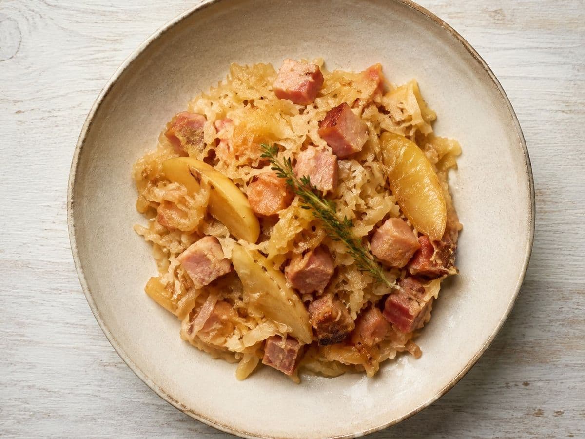 Sauerkraut mit Speck, plated as one serving.