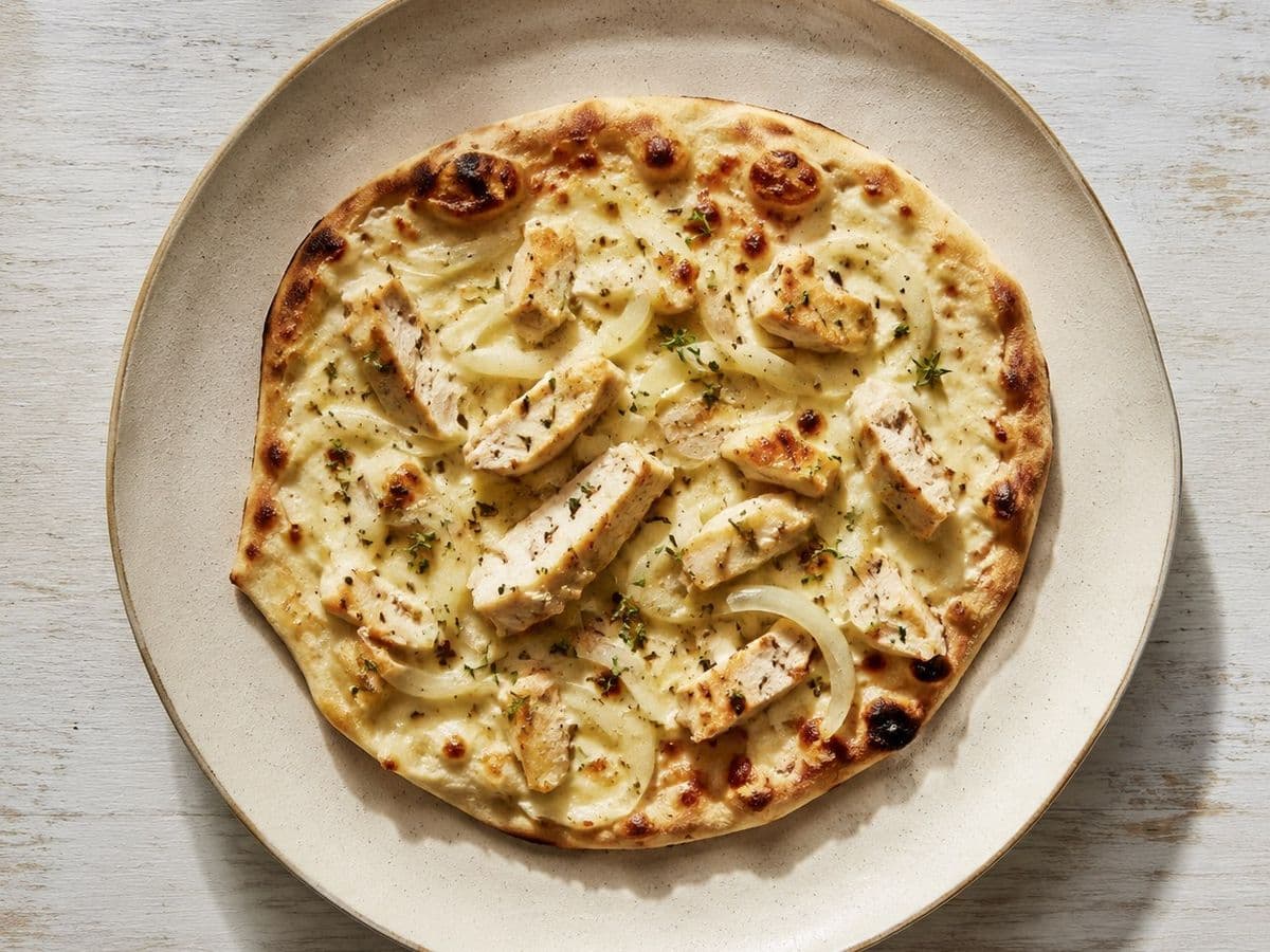 Flammkuchen, plated as one serving.