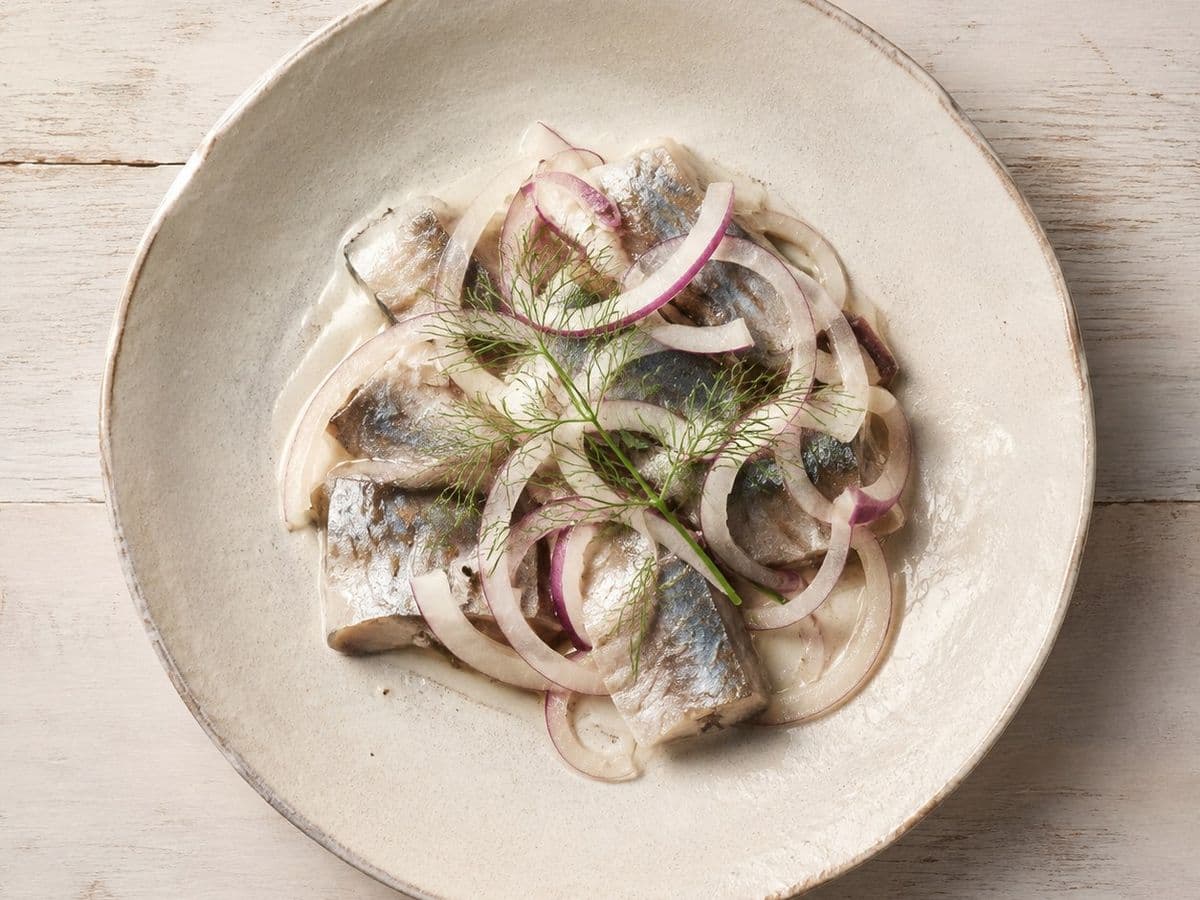 Pickled Herring, plated as one serving.