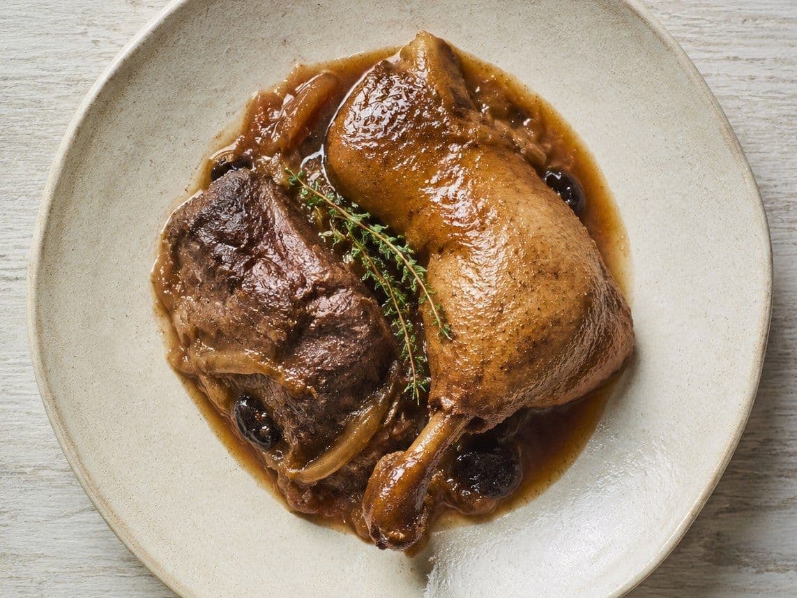 Braised Duck Legs, plated as one serving.