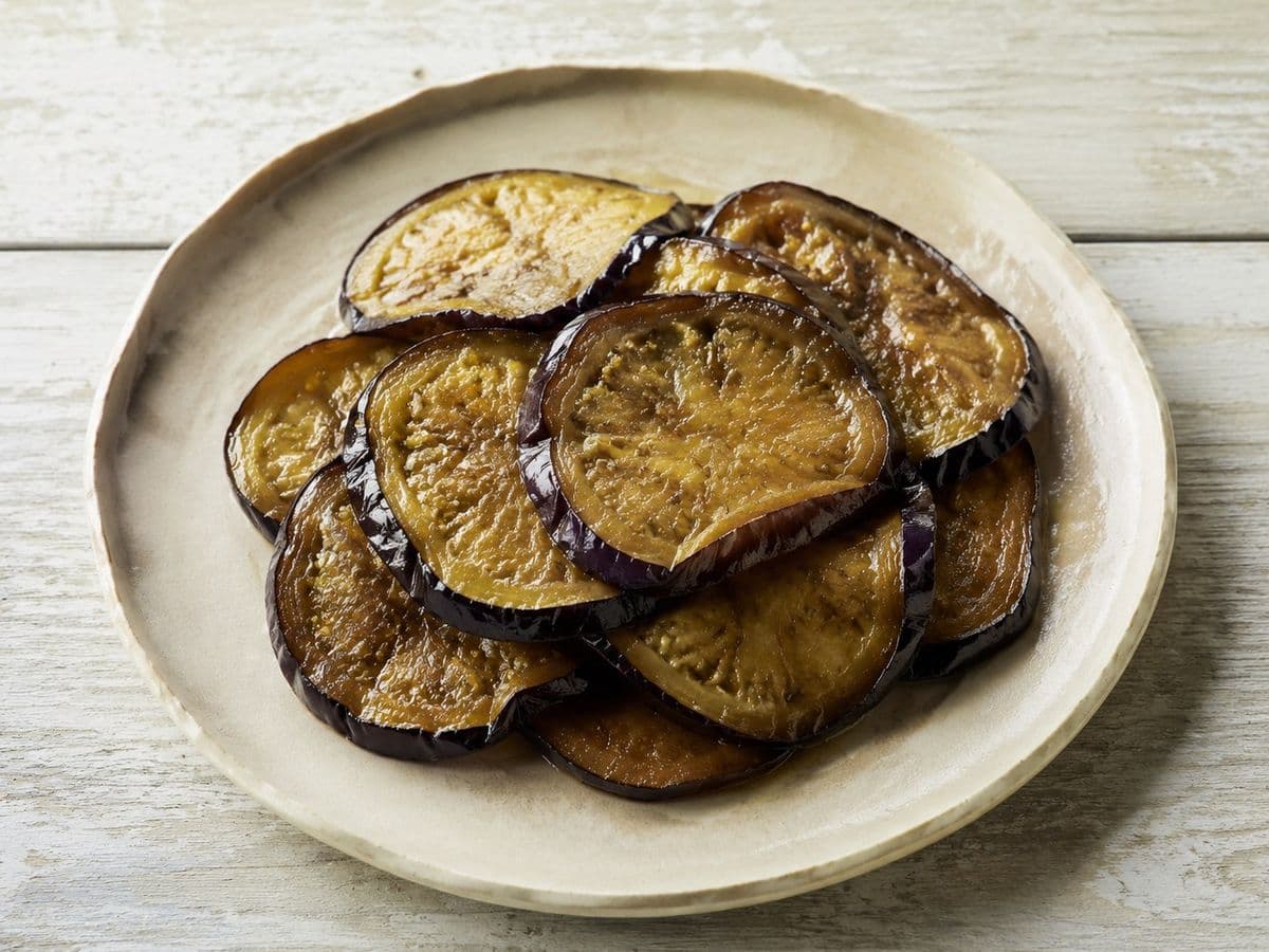 Fried Aubergine Slices, plated as one serving.