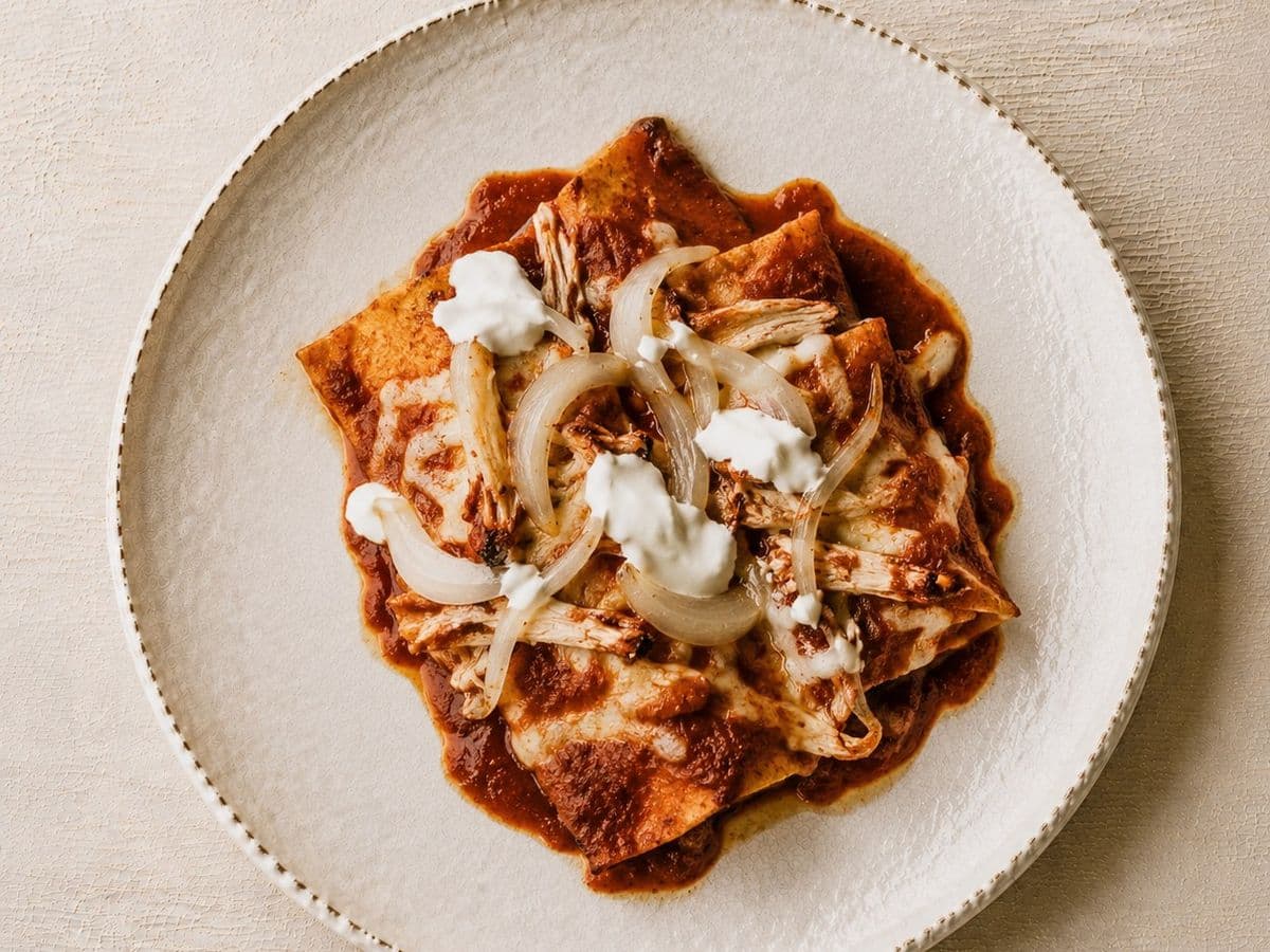Enchiladas Rojas, plated as one serving.