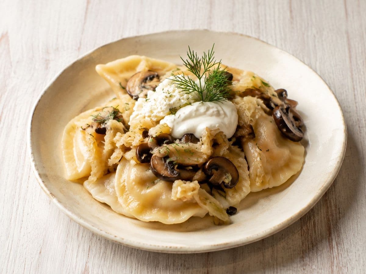 Cabbage and Mushroom Pierogi, plated as one serving.