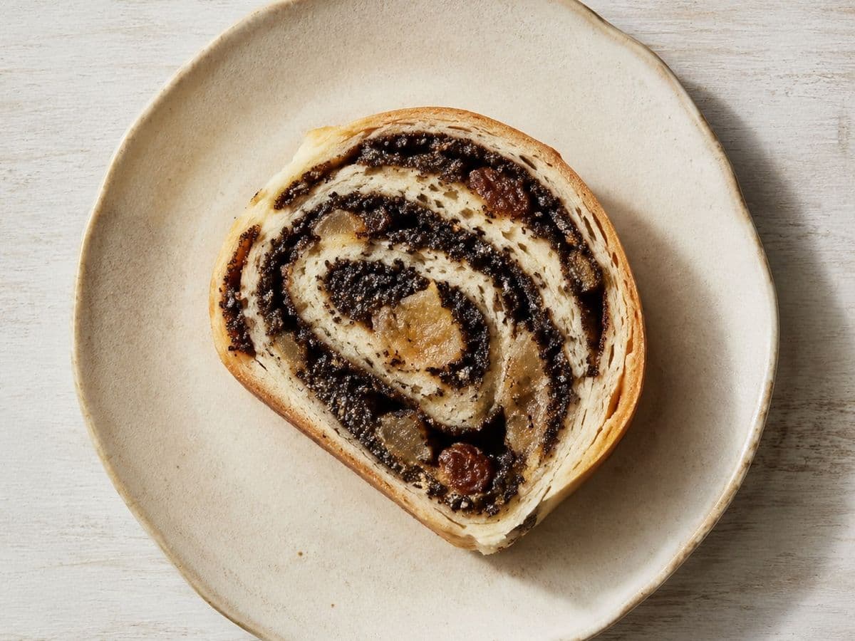 Makowiec Poppy Seed Roll, plated as one serving.