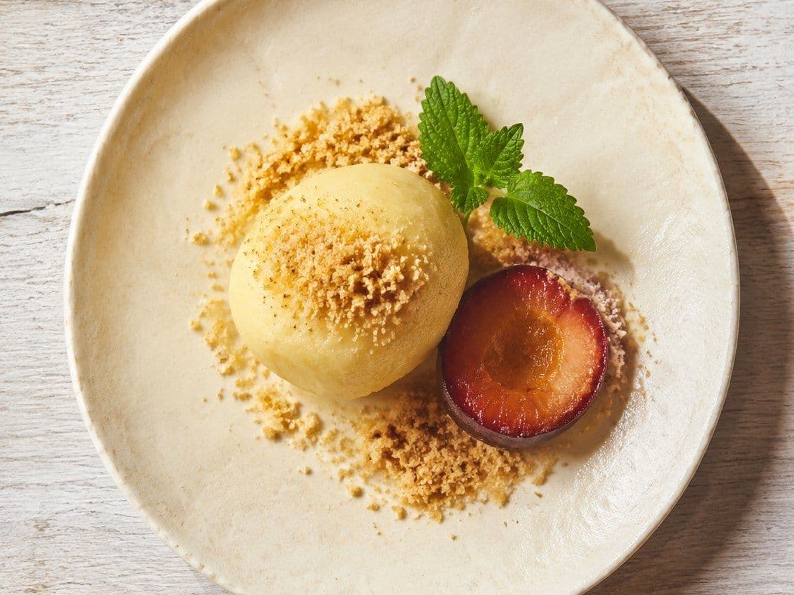 Knedle Plum Dumplings, plated as one serving.