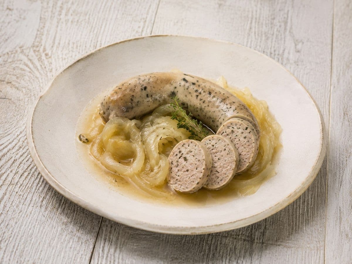 Biala Kielbasa Baked White Sausage, plated as one serving.
