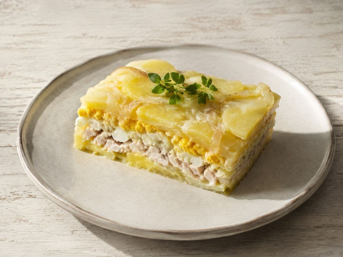 Babka Ziemniaczana Potato Cake, plated as one serving.