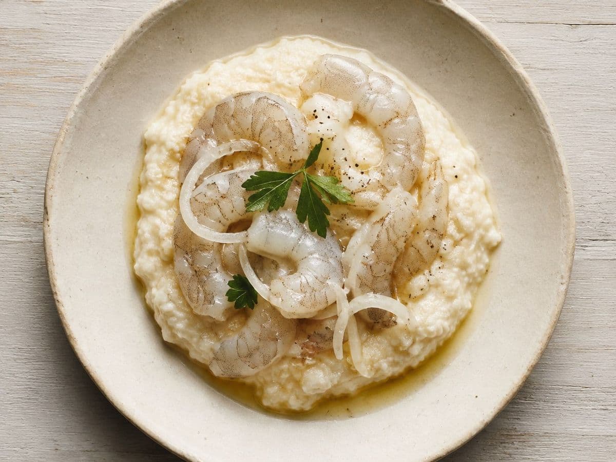 prawn and Grits, plated as one serving.