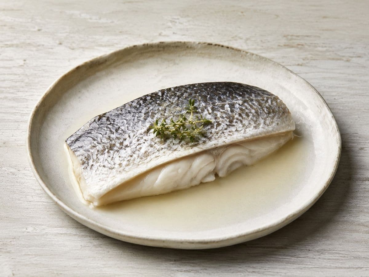 Sea Bass baked in salt, plated as one serving.