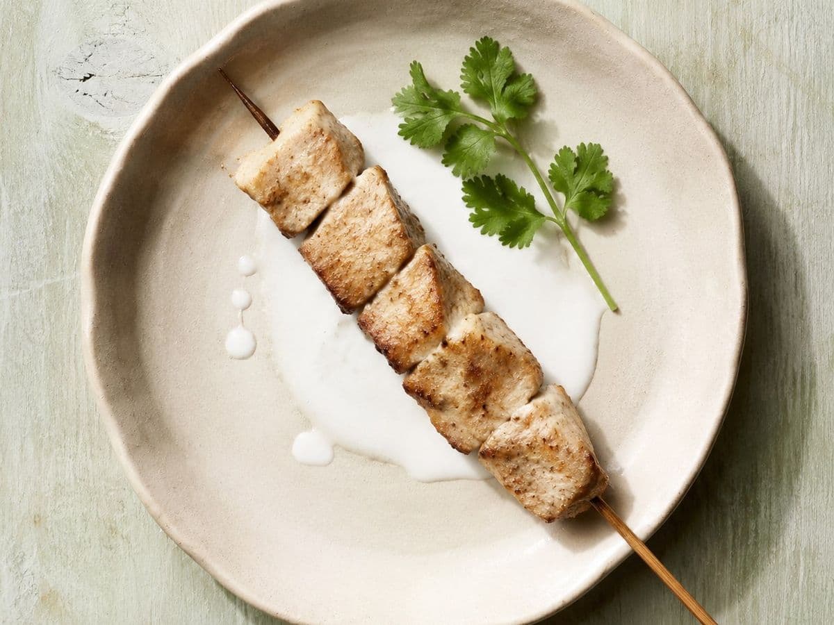 Grilled Pork Skewers, plated as one serving.